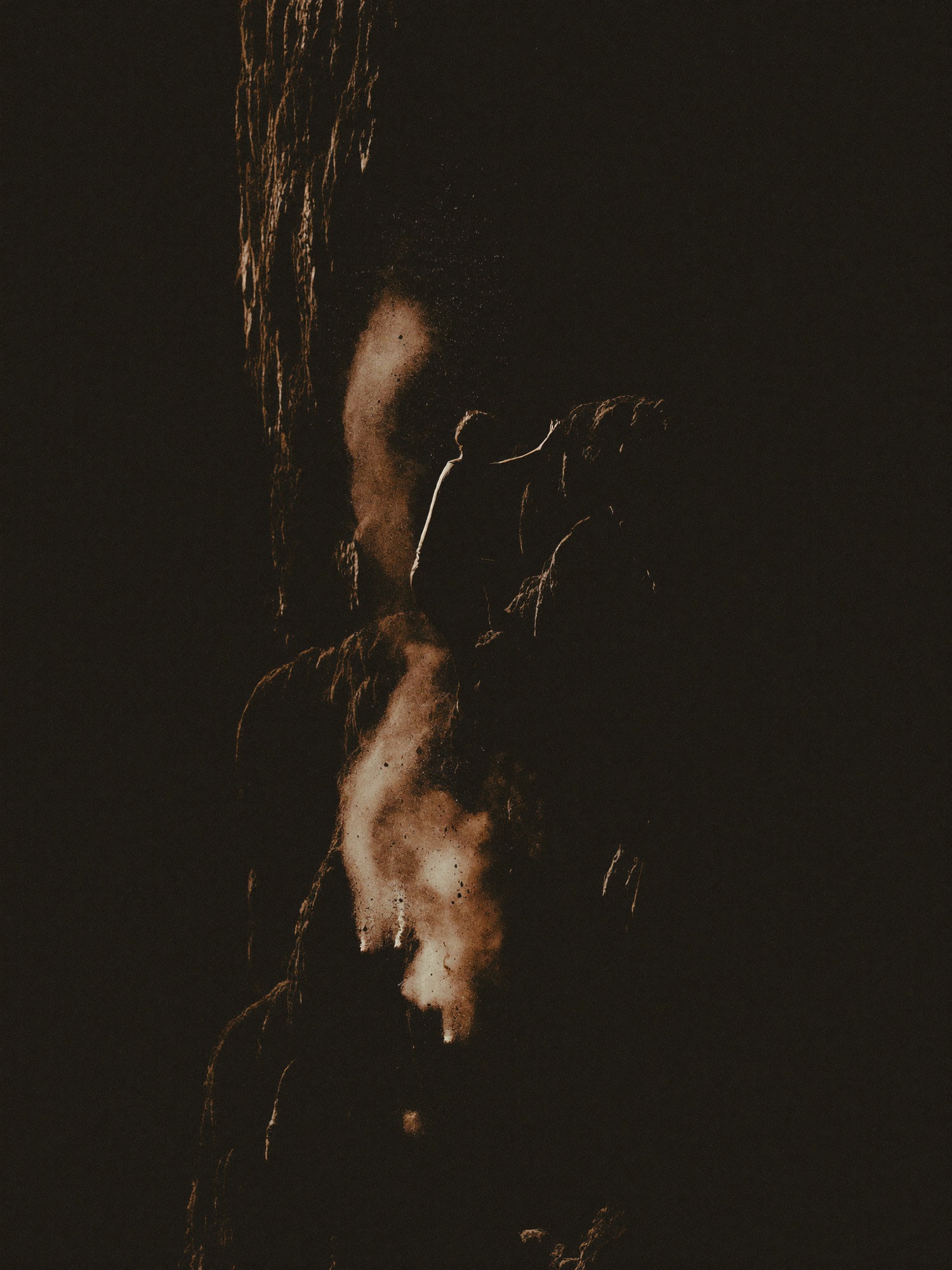 Climber silhouette on an overhanging wall